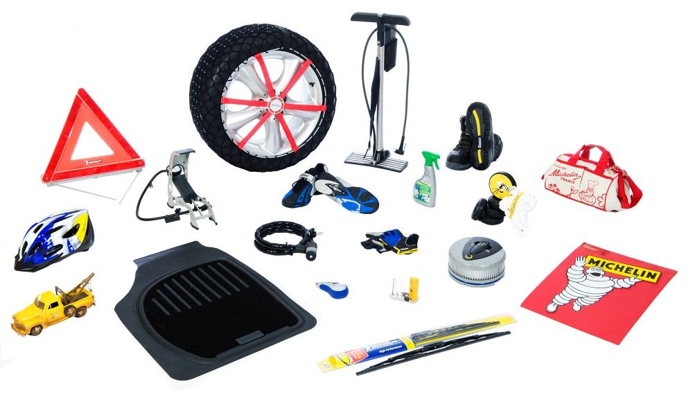 Photograph featuring a variety of items marketed by the group, including derivative products such as a warning triangle, bicycle helmet, anti-theft device, wiper blades and shoes.