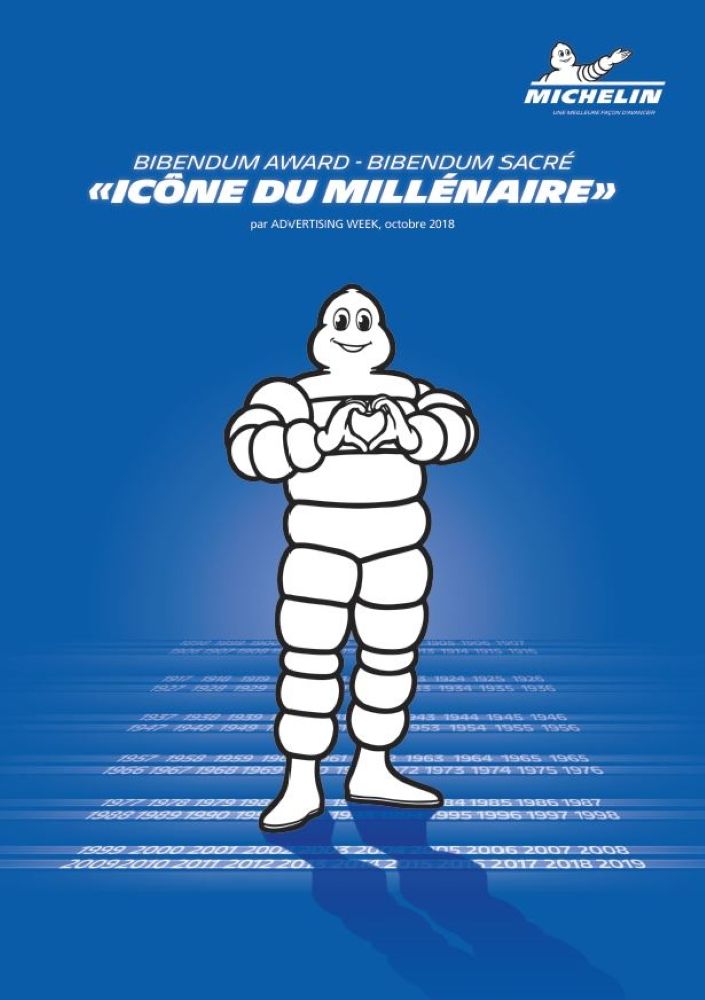 Poster depicting the Michelin Man standing, joining his two hands to form a heart on his chest. It reads: "Bibendum Award, Bibendum Sacré, Icône du Millénaire".