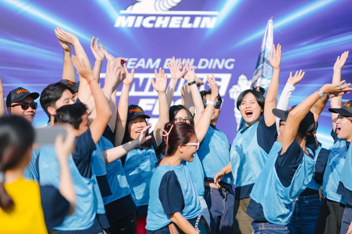 Michelin Asia Pacific employees celebrating together at a team-building event, highlighting a dynamic and engaging career culture.