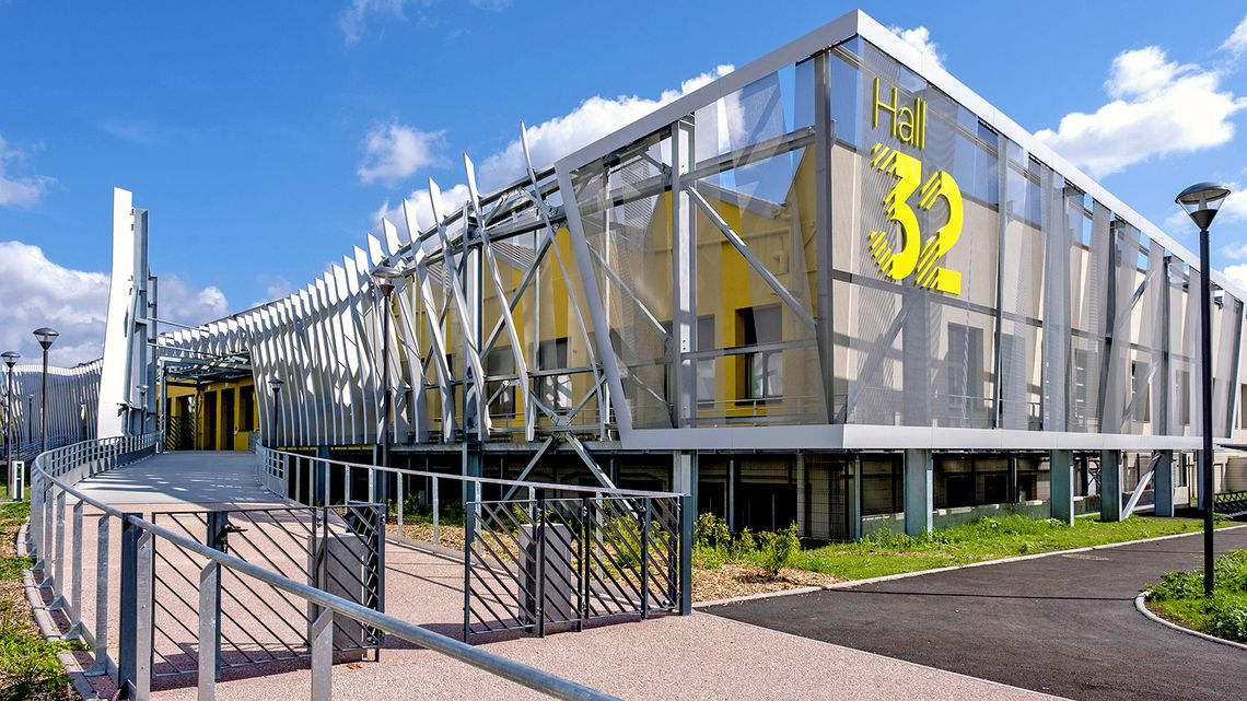 Photograph of the entrance to Hall 32, an industrial trades training center.
